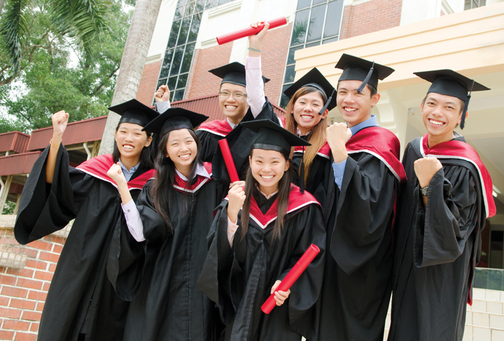 Asian university students celebrate their graduation