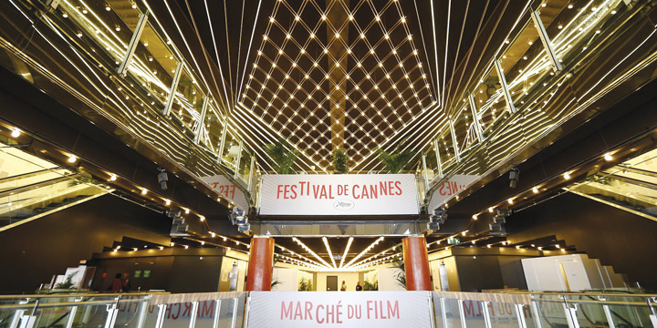 A photo taken on May 14, 2013 shows boards reading "Cannes Festival, Film Market" inside the Palais des Festival in Cannes on the eve of the 66th edition of the Cannes Film Festival. Cannes, one of the world's top film festivals, opens on May 15 and will climax on May 26 with awards selected by a jury headed this year by Hollywood legend Steven Spielberg. AFP PHOTO / VALERY HACHE
