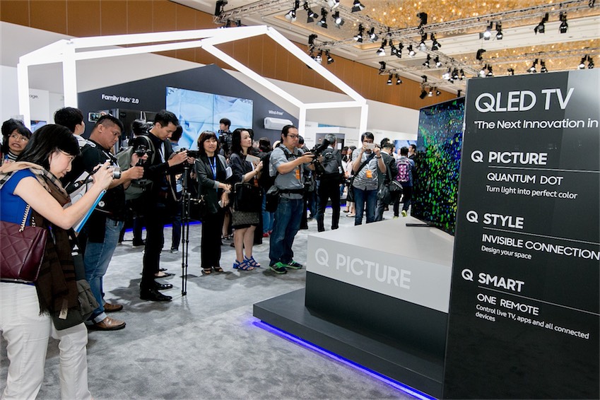 media-and-partners-gathering-around-the-qled-tv