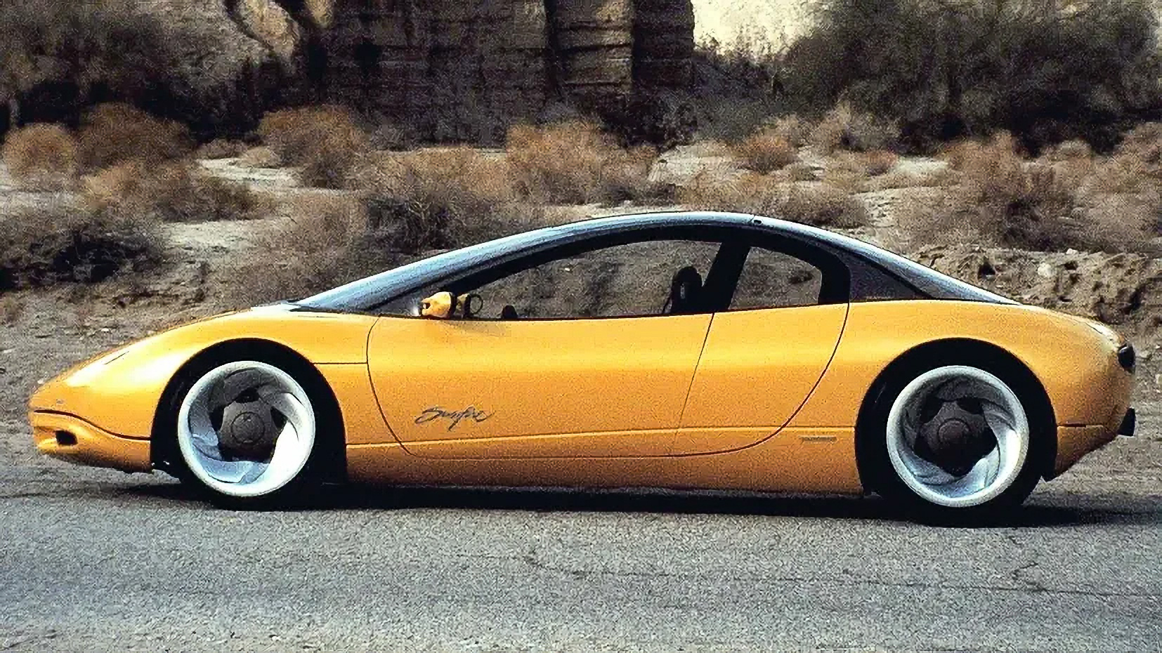 Một mẫu concept car với thiết kế táo bạo, ánh sáng tương lai và đường nét tinh xảo, chưa từng được sản xuất hàng loạt