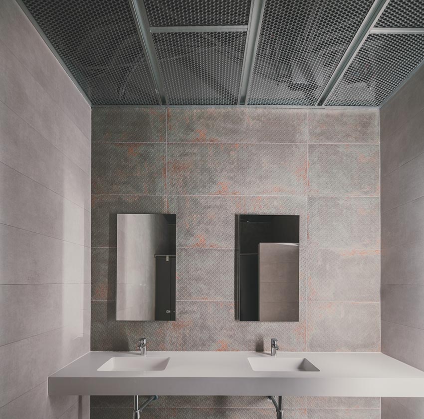 Mặt đứng Leganés Auto Center với lam kim loại trắng và kết cấu xanh mint tại Madrid - 12