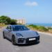 Porsche Panamera 4 E-Hybrid màu đen đang di chuyển trên đường phố đô thị hiện đại - 6