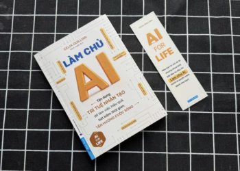 Một nhân viên văn phòng ngồi trước màn hình máy tính trong không gian tối, phản chiếu áp lực công việc và sự hiện diện âm thầm của AI trong đời sống lao động hiện đại - 1